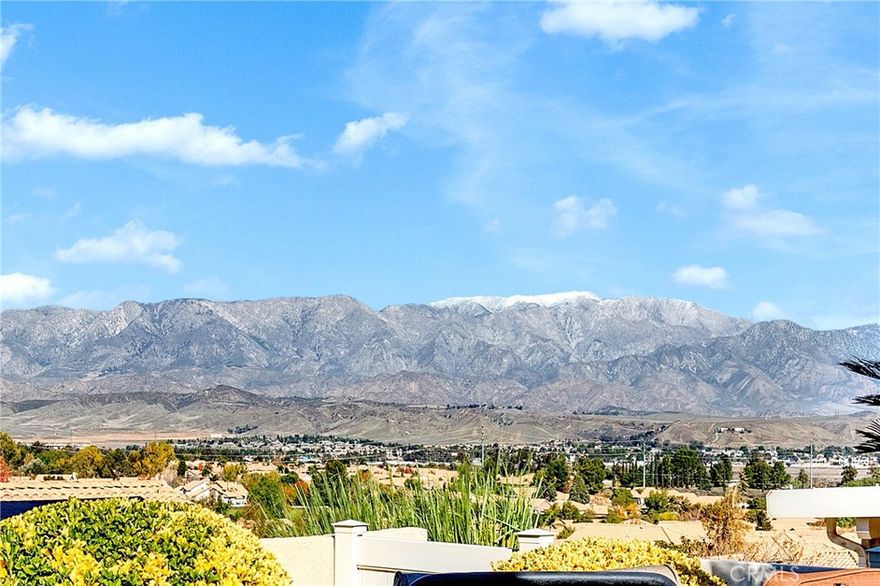 BEAUTIFUL MOUNTAIN & CITY LIGHT VIEWS, PAID OFF SOLAR, and A HUGE PRICE REDUCTION are offered with this Desirable, ONE Story, SUNFLOWER Model (2,018 SF - 2 BR + Office/Den + 3 Bathrooms) in Sun Lakes Country Club, a 55+ Active Adult community with NO MELLO ROOS - Features & Upgrades in this Beauty include:  TWO Primary Bedrooms 'En Suite; A/C Recently REPLACED; Leaded Glass Doors & Windows: Crown & Custom Molding throughout Home; Custom Paint with Coffered Ceilings & Recessed Lighting; Family Room / Great room Adjacent to Kitchen with Cozy Fireplace; The Open Entertainer's Kitchen has LOTS of Cabinets, SS Appliances, & Attractive Decorator Touches; Central Vac System; Wonderful Natural Light Flow; Professional Organized Walk-in Closet.  The Exterior offers an Attractive Front Courtyard; Classy Stamped Concrete & Brickwork; Colorful Garden Areas, A Viewing Deck; Easy Care Customized Alumawood Patio Cover across the Back of the home, and ABOVE IT ALL VIEWS........ Sun Lakes Country Club goes beyond just a place to live - It's a vibrant community designed to keep you Active & Engaged, offering: TWO 18-HOLE GOLF COURSES with 2 Pro Shops, THREE Clubhouses, TWO Restaurants, Bar & Lounge, Tennis, PICKLE BALL COURTS, Pools (Including Large Indoor Pool), Jacuzzi Spas, THREE Fitness Centers & Fabulous Planned Activities Offered on a Daily Basis. There are 80+ Social CLUBS, including: Dancing, RV Club, Yoga, Table Tennis, Cards, Bocce Ball, Bowling, Car Club, Drama/Theatre Club, Sewing, Tennis, Knitting, Bingo, Travel, Quilters, Art League, International Culture, Genealogical Society, Garden, Photography, Travel, and a lot MORE .... If that's not Enough, Add TRIPS AND TRAVEL EXCURSIONS scheduled all year long. Association Dues INCLUDE CABLE TV & INTERNET - The community is Located Close to Casinos, World Famous Shopping (Cabazon and Palm Springs), Restaurants, and Excellent Medical Facilities - SUN LAKES COUNTRY CLUB is has a backdrop of two Mountain ranges, which offer stunning views - LIFE IS GOOD in our Awesome Community!