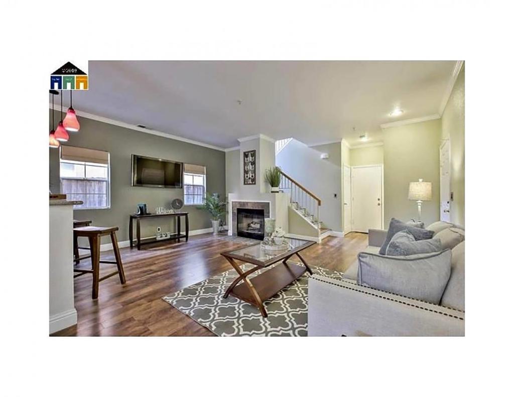 Free standing Home on cul de sac in gated community within New Haven School District. DOWNSTAIRS: large common area that includes kitchen with granite counters; gas stove with hood; side-by-side refrigerator; Dining area; LR with space for wall mounted TV; and a gas fireplace. High ceilings and fire sprinklers for safety. The floor is mostly engineered hardwood. Also downstairs is a 1/2 bath and an entry closet, as well as 2 Car garage with opener, storage, laundry equipment. UPSTAIRS: 4 bedrooms and 2 baths. Hallway and MBR have hardwood floors; double sink in master bath; tub-over-sink. Cables go to MBR and 4th BR. Double paned windows throughout with Venian blinds. Outside adjacent to kitchen and dining area is a large private patio. Most of fencing is new redwood.