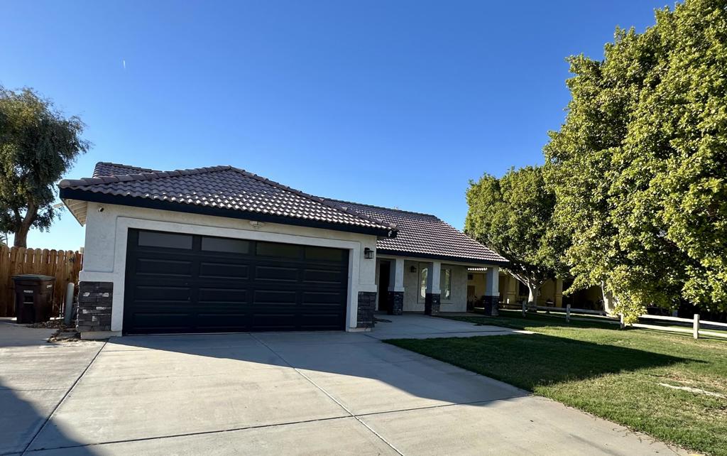 This move-in ready home is located in the desirable Palo Verde Oasis Community. It features a large open layout with upgraded waterproof vinyl flooring, recessed lighting, modern fixtures, and ceiling fans. The classic white kitchen cabinets I oversized island are complemented by all stainless-steel appliances, including your very own wine fridge, water softener and washer & dryer. The large covered back patio is perfect for entertaining, with concrete front and back for toys or trailer parking. The AC unit and water heater are newer, and the back fence was recently replaced. The seller is offering fully paid buyers' closing costs. If you're looking for a move-in ready property, look no further! No HOA fees & No Solar!