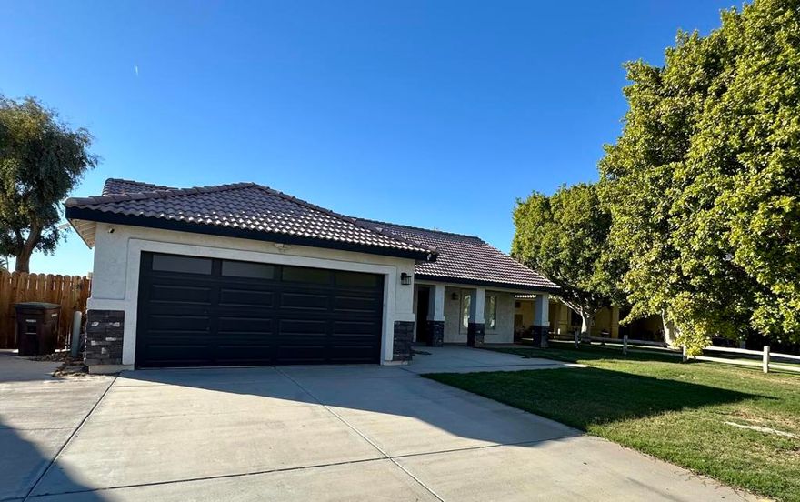 This move-in ready home is located in the desirable Palo Verde Oasis Community. It features a large open layout with upgraded waterproof vinyl flooring, recessed lighting, modern fixtures, and ceiling fans. The classic white kitchen cabinets I oversized island are complemented by all stainless-steel appliances, including your very own wine fridge, water softener and washer & dryer. The large covered back patio is perfect for entertaining, with concrete front and back for toys or trailer parking. The AC unit and water heater are newer, and the back fence was recently replaced. The seller is offering fully paid buyers' closing costs. If you're looking for a move-in ready property, look no further! No HOA fees & No Solar!
