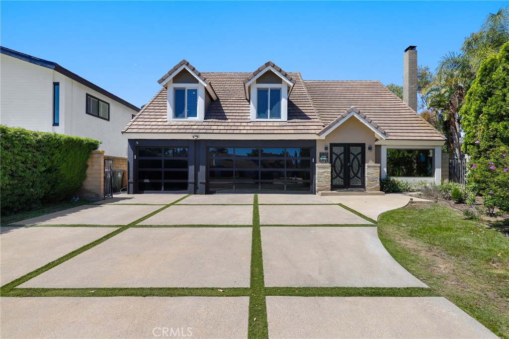 Experience luxury living at its finest in this stunningly remodeled home, where breathtaking panoramic views of city lights and the golf course set the stage for unforgettable moments. Step into your private backyard oasis featuring a gorgeous infinity pool, built-in BBQ, and endless vistas—perfect for entertaining or relaxing in style. Inside, the home showcases fully upgraded interiors with brand-new flooring, fresh paint, recessed lighting, and a chef’s kitchen boasting two-tone cabinetry and soft-close drawers. Unique features like a glass-enclosed under-the-stairs wine cellar, a full home gym, and a finished attic ideal for a game room or hangout space elevate the lifestyle even further. The attached 3-car garage includes its own AC unit for added comfort, and there is an EV charger on the exterior of the house.
Retreat to the spacious primary suite offering stunning views, a remodeled spa-like bathroom with dual sinks, a soaking tub, a walk-in shower, and custom closet organizers. A convenient downstairs bedroom and full bath make this home ideal for guests or multi-generational living.
Best of all, this exceptional property comes with no Mello-Roos, no HOA dues, and is zoned for top-rated Orange Unified School District—making it an unbeatable value in a prime location. This is more than a home—it’s a lifestyle opportunity you won’t want to miss.