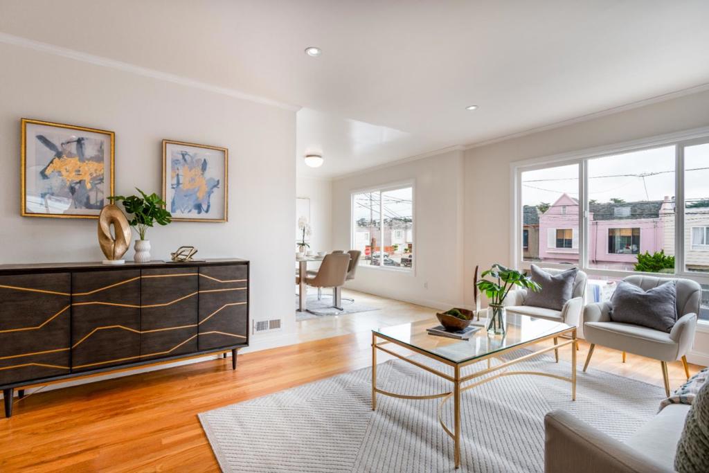 A fully permitted and legal four bedroom two bathroom home in the heart of San Franciscos Sunset District. This bright and expansive residence is designed for both comfort and versatility, offering two bedrooms and one bathroom upstairs along with two bedrooms and one bathroom downstairs. The layout is ideal for multi generational living, extended family, guests, or anyone who values both privacy and connection under one roof. Natural light streams through large front windows and skylights, creating a warm and uplifting atmosphere in every room. The property also features two additional legal family rooms that can be customized as a home office, media room, playroom, fitness area, or entertainment space, giving you options to adapt as your lifestyle evolves. Perfectly located near top rated Sunnyside Elementary and A P Giannini Middle School, this home is also just a short trip to Ocean Beach, Golden Gate Park, neighborhood cafes, and local conveniences. Move in ready and thoughtfully designed, this home delivers the ultimate San Francisco lifestyle where coastal charm meets vibrant city living. Experience the space, light, and flexibility that makes this Sunset home a true standout.