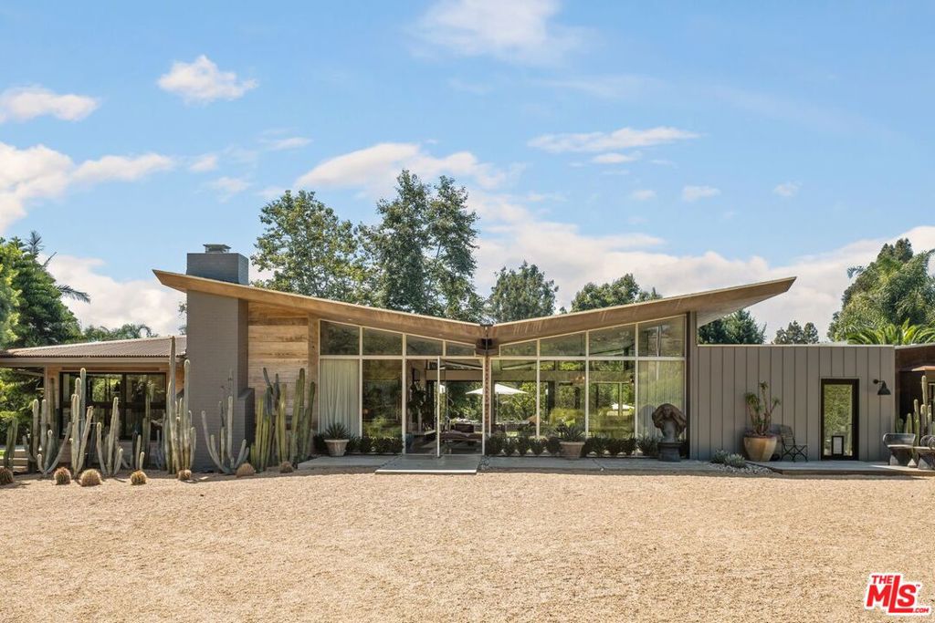Welcome in to one of Malibu's most beautiful sanctuary properties located in the highly coveted neighborhood's of Bonsall Cyn. Fully reimagined in 2016 by Vitus Matare, this 3 bed 5 bath architectural gem sitting on approximately 1.5 acres has been recently updated with designer finishes that enlighten every inch of the home. As you enter you're immediately wowed with the design blend of steel, wood, heated concrete floors & views from every room in the house. The living room's large open concept leads you into the chefs kitchen with high end appliances. The Master wing of the home has been tastefully adorned with colors from the rose quartz bathroom counters, to the vibrant De Gournay wallpaper in the Master bedroom. 2 additional bedroom on the opposite wing each with own en suite, with an extra washer/dryer. Each bedroom opens up to its own patio with views of the large entertainers backyard with an in ground heated pool/spa, putting green, sauna & beautiful fruit trees ( Peach, nectarine, apricot, plum, strawberry tree and more) that surround the property. A detached 798 studio/workshop w/ large outdoor shower at the rear of the property. 2 car garage w/ separate gym, 2 charging stations for EV. Ultimate privacy with views of Zuma canyon, minutes from Bonsall trailhead, Zuma/Westward beach and close to many restaurants & shopping. Not to be missed!