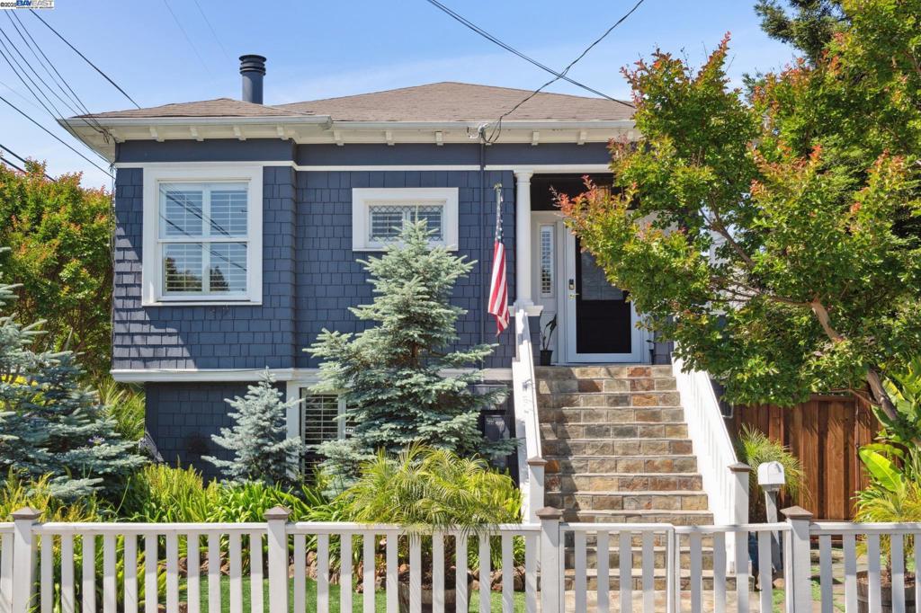 This beautifully preserved 1906 Craftsman duplex offers character, comfort, and flexibility—all nestled on a desirable corner lot. With a thoughtfully designed layout and an entertainer’s dream of a backyard, this property is perfect for homeowners and investors alike. The upper-level unit features two spacious bedrooms and one full bath, a bright and inviting family room with a cozy fireplace, a large formal dining room, and an expansive kitchen complete with a gas range and built-in bar top seating. Step out from the kitchen onto a sun-soaked patio, ideal for al fresco dining and morning coffee. Downstairs, the garden-level unit offers its own private entrances, two additional bedrooms, a full bath, a kitchen conveniently located next to the side yard, and a versatile bonus room—perfect as an office, studio, or guest space. An attached two-car garage provides ample space for parking or storage, complemented by additional gated driveway parking for added convenience and privacy. But the true highlight? The lush, tranquil backyard. Featuring a curated selection of mature trees and diverse plantings, multiple seating areas, and a relaxing hot tub, this serene outdoor space feels like your own private retreat. Live in one unit and rent out the other!