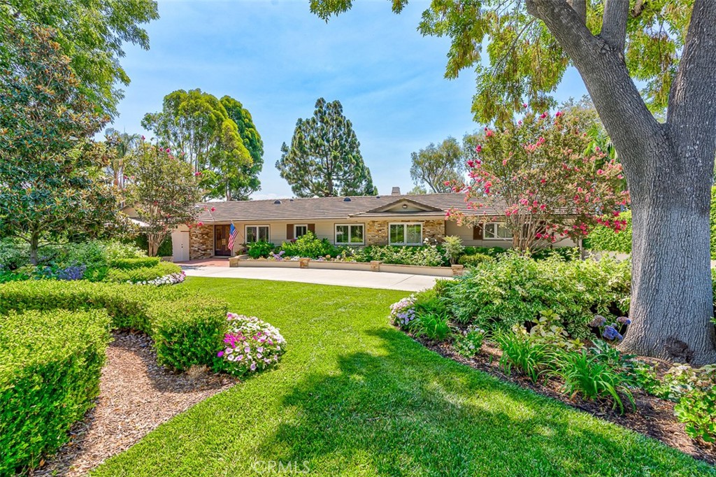 Timeless Luxury in prestigious Old Sunny Hills. Nestled at a quiet cul-de-sac in the coveted Old Sunny Hills neighborhood. This one-of-a-kind single-story custom estate blends timeless elegance with resort-style living. Set behind a private automatic security gate with a circular driveway, the home welcomes you with exceptional curb appeal, privacy and sophisticated comfort. Step through a custom-designed front door into a formal entry, where soaring ceilings and a fireplace create an inviting atmosphere in the formal living room. Every detail is thoughtfully crafted for comfort, style, and entertaining. At the heart of the home is a gourmet kitchen designed for culinary excellence, featuring granite countertops, a spacious center island, custom cabinetry, and high-end appliances, including a six-burner gas cooktop, a Sub-Zero refrigerator, a wine fridge, and a built-in Miele Coffee maker. The adjoining family and dining areas flow seamlessly for effortless gatherings. The luxurious master suite offers a spa-inspired bathroom with a soaking tub, walk-in shower, private dressing area and a generous custom closet. A skylight retreat space opens to a private patio with a water fountain, perfect for morning coffee or quiet reflection. The backyard is a true showpiece —a private paradise built for entertaining and relaxation, featuring a covered patio and outdoor fireplace. Full outdoor kitchen with BBQ grill, sink, and refrigerator. Sparkling swimming pool. Champion-size tennis court with sports-viewing gazebo. Landscaped putting green. 2-car attached garage with direct access, covered carport parking and a potential RV parking area. Backed by the Hiltscher Park trails. This rare estate offers the ultimate combination of privacy, luxury and accessibility- award-winning schools, St Jude hospital, dining, shopping and parks.