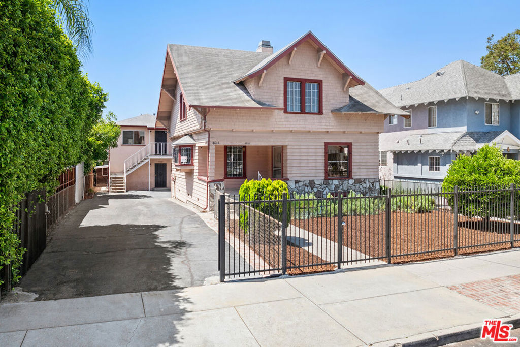 In vibrant Los Feliz, this fourplexproperty is a standout opportunity for an investor or owner-user, with two units delivered vacant, including the spacious main home. Set on an oversized lot, the front residence is a Prairie-Craftsman circa 1905 with hardwood floors, vintage built-ins, a spacious kitchen with O'Keefe & Merritt stove, and postcard views of the Griffith Observatory. Three bedrooms, two baths, and a sunroom set up as a guest room provide versatility. The rear structure holds three 1-bedroom, 1-bath units with updates in select interiors; one unit is delivered vacant. Generous outdoor space features fruit trees, low-maintenance landscaping, and plenty of room to park multiple cars. Just blocks from Vermont Avenue and close to local favorites Alcove, Farfalla, Home, All Time, Skylight Books and more, this is your chance to own an income-producing property in one of LA's most desirable neighborhoods.