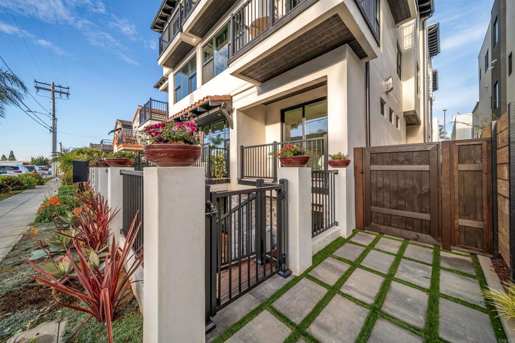 Discover your dream home with this exquisite new construction located near the vibrant heart of the coastal Oceanside community! Just a short walk away, you'll find beautiful beaches, eclectic restaurants, charming boutiques, lively breweries, and an exciting nightlife scene, as well as convenient bike paths and a welcoming community atmosphere. Designed with luxury in mind, this home features top-of-the-line appliances and upscale designer materials. Revel in the elegance of marble countertops alongside the stunning leather-finished granite kitchen island—an entertainer's delight! The main floor includes a full ensuite bath and a bedroom that opens up to its own private balcony. On the lower level, you’ll find two more spacious bedrooms with full bathrooms, including the luxurious primary suite. It boasts a stackable washer/dryer, a soaking tub, and generous walk-in closets for all your storage needs. Flexibility abounds with the option to separate and lock off the main floor from the lower level, offering privacy for guests or an excellent rental opportunity. The downstairs also impresses with a large bonus living area, featuring a kitchenette/bar that seamlessly connects to the outdoor courtyard through expansive folding glass doors. Enjoy the ultimate in year-round entertainment while grilling and gathering around a cozy firepit setting. Located at 812 N Cleveland Street, this property stands out along the entire San Diego coast for its unparalleled design and prime location. Don’t miss the chance to make this one-of-a-kind coastal retreat your own!