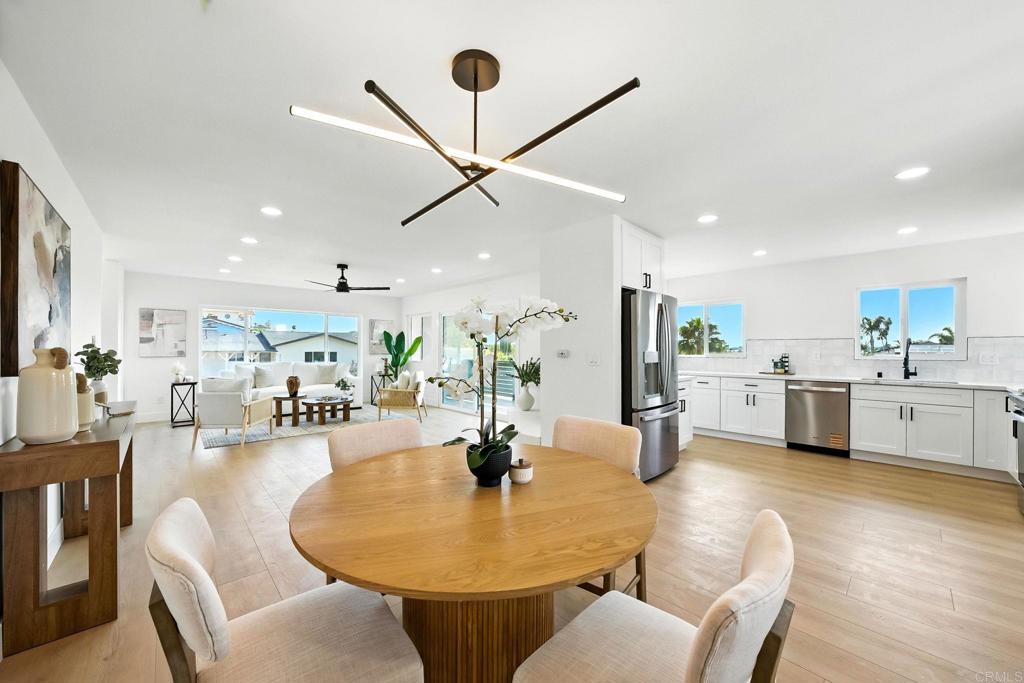 Welcome to this beautifully upgraded tri-level residence nestled on a spacious corner lot in highly desirable Bay Park! Featuring 4 bedrooms, 3 bathrooms, and a 2-car garage, this light-filled home offers comfort, style, and flexibility for modern living. With two primary suites each with a private bathroom and one boasting a walk-in closet this layout is ideal for multi-generational families or guests. Enjoy the elevated living room with a cozy fireplace and a balcony that offers peek-a-boo views of Mission Bay, perfect for sunsets and entertaining. The remodeled kitchen showcases sleek quartz countertops and opens seamlessly to the dining area. All bathrooms have been tastefully remodeled with high-end finishes, and new luxury vinyl plank flooring runs throughout the home. Additional highlights include upgraded plumbing, exterior access, and two fireplaces for added warmth and charm. The large backyard provides ample space for outdoor living or future expansion, including ADU potential for added income or extended family. This is a rare opportunity to own a versatile and beautifully updated home in one of San Diego’s most sought-after neighborhoods just minutes from beaches, parks, shopping, and top-rated schools!