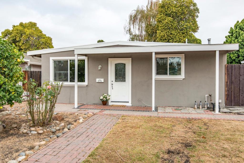 Charming Sunnyvale bungalow close to amenities*Great floor plan w. open living space facing front yard and lots of light*Open kitchen with pinewood cabinetry, granite counter tops, recessed lighting, new stove, w. eating area and sliding door to yards*Updated bathroom w. tub and tile surround*Laminate flooring*Spacious yards to make your own, with concrete patio and decking*Detached two car garage w. automatic opener, newly replaced door and plenty of storage*Conveniently located*Walk to Fair Oaks Park*