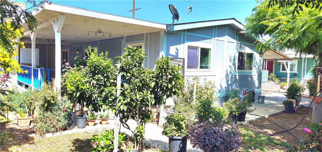 Spacious 3 bedrooms, 2 bathrooms Manufactured home, on a permanent foundation. This home offers newer windows, good size lot, attached patio in the front, an additional detached free standing patio at the back yard with newer cemented slab, great for family gatherings, there is also an attached carport for your vehicles, laminated flooring, Central A/C, good size living room and dinning area with breakfast nook.