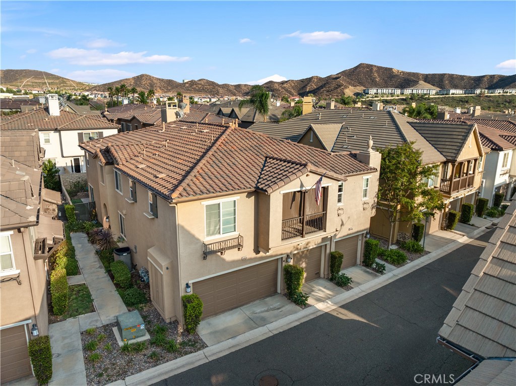 Welcome to this charming 2-bedroom, 2.5-bathroom townhome in the highly desirable Plum Canyon @ Mariposa community. Upon entering, you’re greeted by a bright, open living space that flows seamlessly into the kitchen, dining area, and half bathroom. The home features tile flooring and recessed lighting downstairs, along with direct access to a private backyard with beautiful trees, perfect for relaxing or entertaining. Upstairs, both bedrooms offer en-suite bathrooms, providing comfort and privacy. Additional highlights include a newer water heater, a laundry room, an attached 1-car garage with a 220-volt outlet, an assigned covered carport space, and included appliances for your convenience. Community amenities include a pool, spa, BBQ area, playground, and clubhouse. With No Mello-Roos and a prime location near top-rated schools and Skyline Ranch Plaza—featuring Starbucks, restaurants, a market, and more—this home has so much to offer!