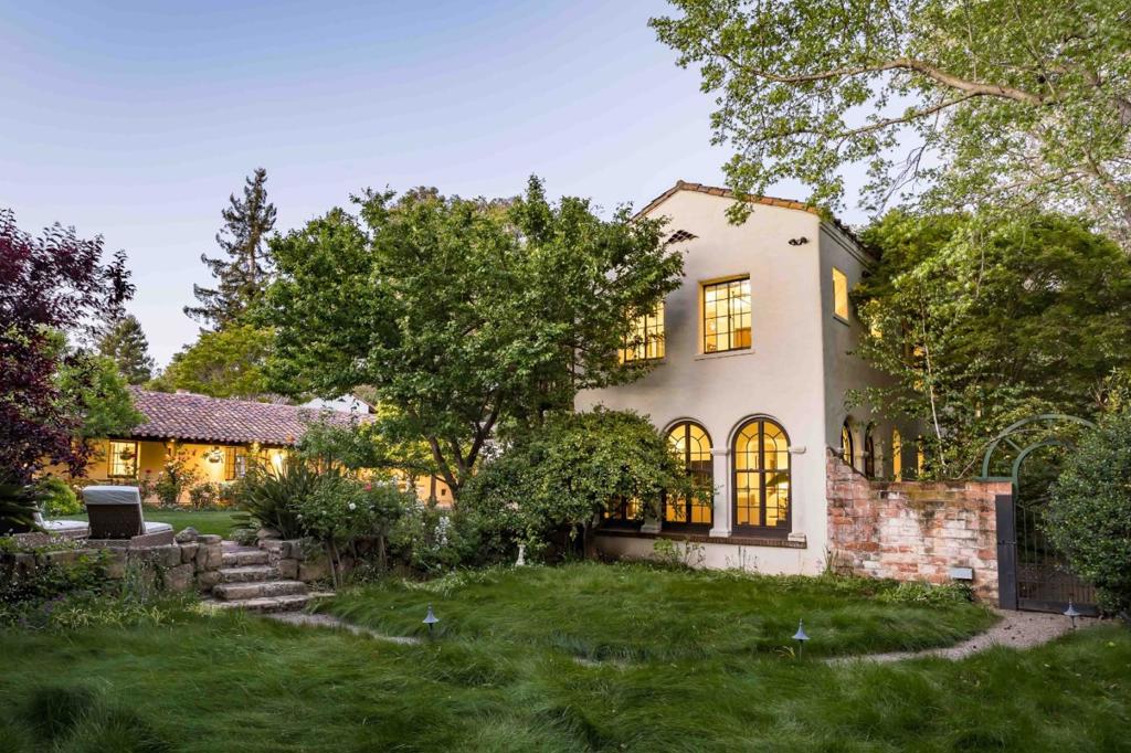 Step into the rich history of Palo Alto with this stunning estate, meticulously crafted by the renowned Birge Clark. Known as the Dunker House, this estate stands as a testament to the indelible mark left by Clark on California architecture, embodying his signature Spanish Colonial Revival style throughout nearly 6,700 sf. Resting on over .60 AC with a heritage dating back nearly a century, it has been thoughtfully updated to cater to modern living. Lavish spaces boast expansive gathering areas, a gourmet kitchen, office, indoor & outdoor fireplaces, and luxurious bedrooms. The sprawling grounds provide a west coast oasis filled with idyllic venues for outdoor enjoyment, complemented by a guest house and wine cellar. Nestled at the end of a cul-de-sac, this gated estate provides serenity and seclusion while being conveniently close to University Avenue, Stanford University, commuting options, and esteemed schools. Experience the epitome of Palo Alto living in this exceptional estate