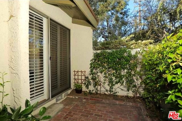 The ultimate Townhome awaits in quaint Studio Village. Lush landscaping & a private patio are the opening act of this spacious, light-filled end unit. The unit opens up to 2 levels of living space complete w gorgeous wide plank wood floors, open truss ceilings & recessed lighting. The bright & spacious living room & fireplace features built in book shelving & plantation style shutters - opening to a private brick patio. A galley style chef's kitchen with white cabinetry, stainless appliances & granite counters & back-splash open to a large formal dining room overlooking the living area, giving the home an open feel & amazing flow. 2 bedrooms and 2.5 baths upstairs, including a master suite with dual sinks and a large W/I closet. A downstairs powder rooms adds convenience for guests. A private 2-car garage w Washer/Dryer & uber hip location make this a compelling package in 1506 square feet of prime living space. Lease includes Basic Cable, Resort living with Pools and Tennis Courts.The