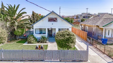 Photo of 1454 E 43rd Pl, Los Angeles, CA 90011 (MLS # DW26040746)