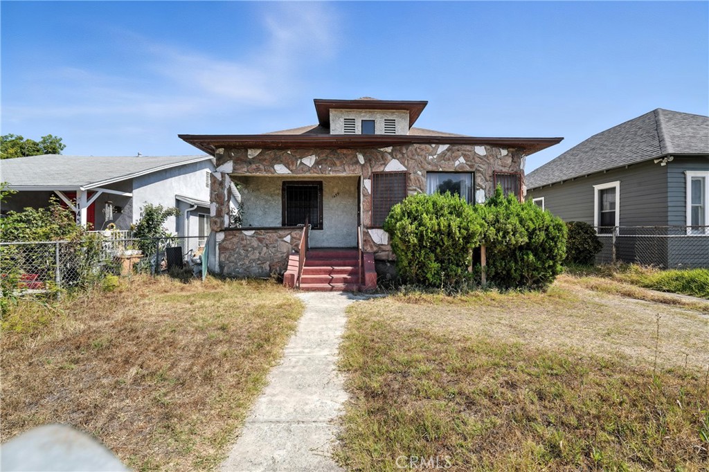 Investor Opportunity! This 2 bedroom, 1 bath home with a small bonus room ideal for an office or playroom is a true diamond in the rough. Situated on a 5,100 sq. ft. lot and zoned R2, this property offers incredible potential for redevelopment or expansion. Key features include a basement, attic space, indoor laundry area, and large windows that fill the open floor plan with natural light. A long front driveway provides ample parking. Whether you're looking to renovate, add units, or build new, this property is an opportunity you won’t want to miss!