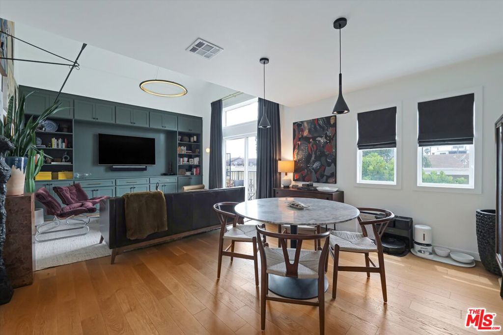 Step into sophistication and style at this top-floor condo in the heart of Mar Vista. This 2-bedroom, 2-bathroom unit is a blend of modern flair and a chic speakeasy vibe, perfect for those who know that life is too short for dull living. Imagine high ceilings and wood floors underfoot, setting an elegant stage for your unique lifestyle.This vibrant abode boasts an open-concept layout, seamlessly connecting the dining area to the living area, where custom mood lighting invites you to turn on some jazz and shake up a few mocktails. The gourmet kitchen is equipped with sleek stainless steel appliances and smooth granite counters.Nestled in a gated community, this unit offers both security and serenity, with features like a Google Nest security system and 2 car parking in a gated garage. Enjoy the convenience of a washer and dryer in the unit, air conditioning and the option for your furry friend to join you, with pets being conditionally welcome.Outside, the trendy Mar Vista neighborhood beckons, with its renowned weekly farmer's market, Little Fatty's Thai cuisine, Blueys cafe and Alana's Coffee Roasters just a stone's throw away. Here, style meets substance, ensuring your home is as lively as you are. Welcome to your new abode! Seller is offering a 1% buyer closing cost credit too!
