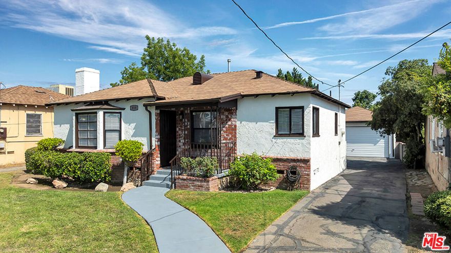 Discover the perfect blend of character, comfort, and convenience at 818 N Brand Blvd in San Fernando, CA. This inviting 3-bedroom, 1-bath single-family home offers approximately 1,074 sq ft of living space on a generous 6,747 sq ft lot. Built in 1941, the home features timeless design elements, a functional layout, and an unbeatable location close to schools, shopping, dining, and easy freeway access. Step inside to a light-filled living room that provides a warm welcome, A Decorative fireplace and plenty of space for relaxation. The layout flows seamlessly into the dining area and kitchen, making it ideal for both daily living and entertaining guests. The kitchen offers ample storage and counter space, with convenient access to the backyard for outdoor dining and weekend BBQs. The expansive backyard is a true highlight of this property. Whether you dream of creating a lush garden, building a play area, or adding an Accessory Dwelling Unit (ADU) for extra income or multigenerational living, this flat, usable lot offers endless possibilities. A detached garage and long driveway provide abundant parking and potential workshop or storage space. This home is minutes from popular parks, local markets, and community amenities. With quick access to the I-5, I-210, and I-118 freeways, commuting to Los Angeles or anywhere in the San Fernando Valley is a breeze. The area's small-town charm, combined with big-city convenience, makes this property an ideal place to call home. Don't miss the opportunity to own this San Fernando single-family home with a spacious lot, prime location, and endless potential. This information has been secured from sources we believe to be reliable, but we make no representations or warranties, expressed or implied as to the accuracy of the information.  References to square footage or age are approximate. Buyer must verify the information and bears all risk for any inaccuracies.