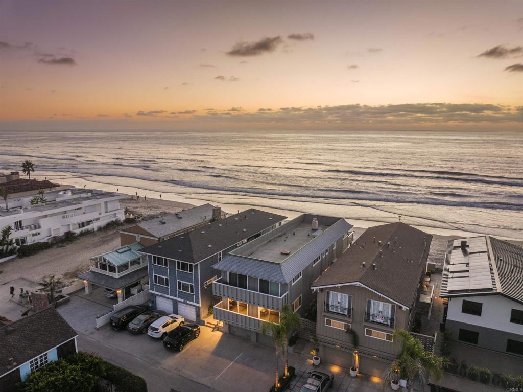 *Major price improvement* Rare oceanfront rental in Del Mar’s Beach Colony available October 1, 2025 - May 31, 2026. This fully furnished 3-bedroom home sits directly on the sand with sweeping ocean views from the living room, dining area, and kitchen. A newly remodeled oversized veranda offers the perfect space for outdoor dining and lounging, with private steps leading straight to the beach. Located just a short walk to Del Mar Village shops and restaurants. Parking for up to 8 vehicles which is an uncommon luxury at the beach.
