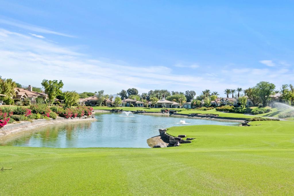 Available December 2025 + March & April 2026 at $11,000/month + monthly caps on electric and gas. Also available October 2025 at $5,000/month + utilities. Landlord pays monthly HOA dues that include cable and internet. Renovated contemporary design home with stunning south golf and lake views! This Acacia 5 floor plan offers breathtaking panoramic views of the lake, mountains, and Grove #7, 1 of 2 Arnold Palmer-designed courses at Indian Ridge Country Club in Palm Desert. The 3-bedroom, 3.5-bathroom condo is just one house away from a beautiful community pool and spa. You will be the first to enjoy the new flooring, stainless steel appliances, new quartz countertops, new large flat screen TVs and furnishings, new AC, new security alarm, and all new lighting. The back patio, with new outdoor furnishings and electric awnings with new Sunbrella fabric, is accessible from both the living and dining areas, perfect for entertaining or relaxing while enjoying the expansive views. The living room includes a fireplace and wet bar, and the kitchen features counter seating, an island, and a small desk area. The primary bedroom has a king bed and a large slider overlooking green foliage creating a sense of calm. The en-suite bathroom offers a soaking tub, shower, dual vanities, separate water closet as well as a large walk-in closet. Both guest bedrooms have been completely remodeled and are also en-suite, each equipped with a designer tiled shower, dual sinks & separate water closet. Landlord's club membership available for tenant use with membership approval with 3 month minimum. Utilize the Fitness Center with the latest strength and cardio equipment, an active schedule of classes, a full-service day spa, and three restaurants with outstanding food. Indian Ridge Country Club offers a never-ending social calendar and is one of the desert's premier private country club communities, centrally located in the Palm Springs area, close to Interstate 10, El Paseo, and the airport.