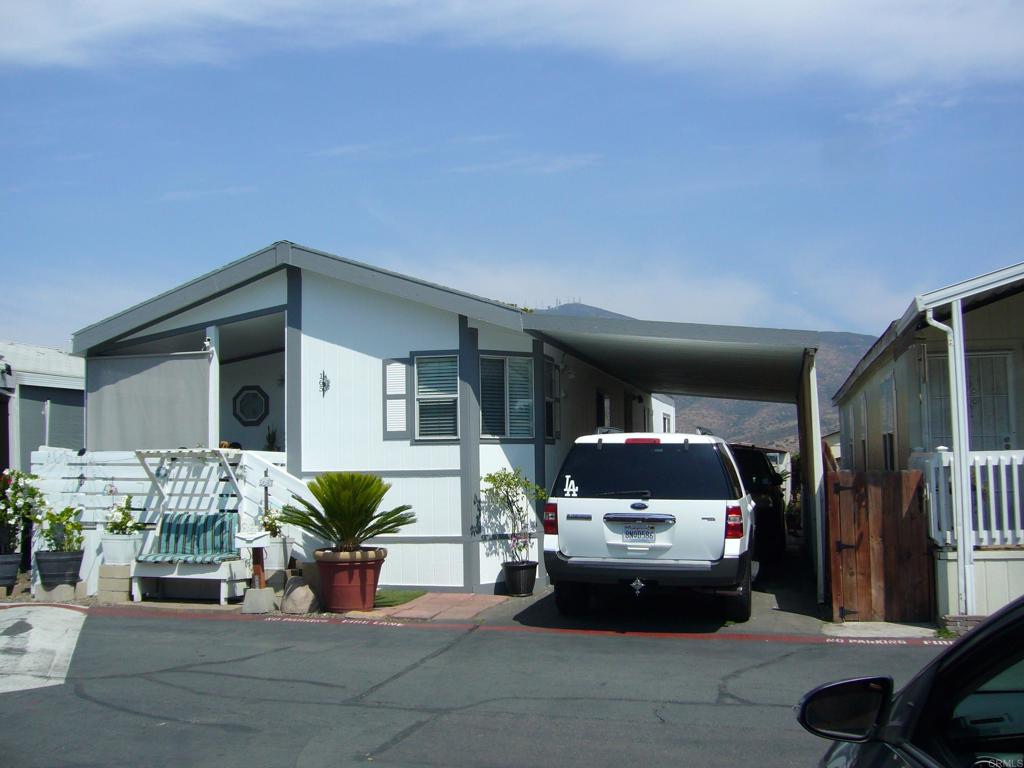 HONEY STOP THE CAR!! Look at this Beautiful and Bright,well-kept 3 Bedroom 2 Full Bath manufactured home in sought after Spring Valley All-Age Family community. The home’s kitchen is Open for lots of cooking and entertaining with plenty of cabinet space. Private laundry room with door to the exterior. Front of home has a good size porch and good size backyard with view of Lake and Mountains. Covered carport for 2 Vehicles. The community offers many amenities like a banquet room for your events, pool, kids playground, BBQ area, basketball court and is right across beautiful Mt. Miguel Mountain and Sweetwater Reservoir. Home is centrally located, close to all beautiful San Diego has to offer, near SDSU. Come see this stunning home before it’s gone!