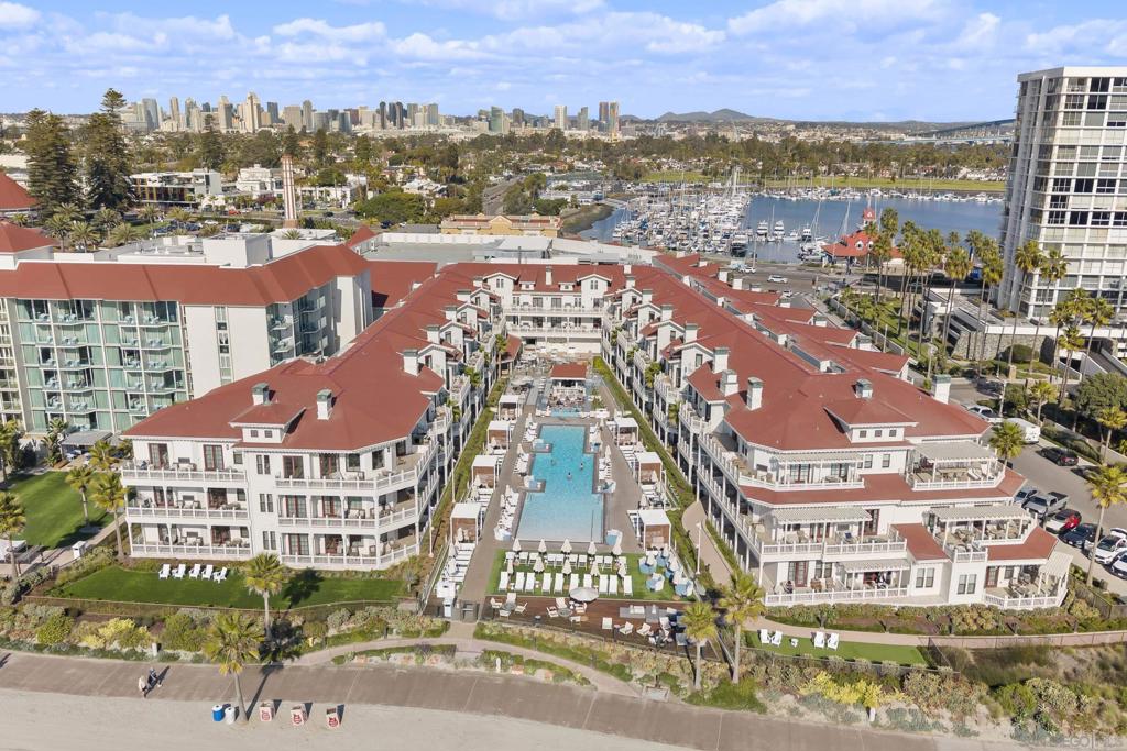 Experience a new level of coastal luxury at Shore House at The Del, where the timeless charm of the Hotel del Coronado meets refined, modern living. This beautifully appointed 2-bedroom residence offers stunning views of the Pacific Ocean, Point Loma, and the Shore House pool—creating a peaceful retreat just steps from the water’s edge. Every element of this home has been thoughtfully designed, featuring bespoke finishes, a seamless indoor-outdoor layout, and a spacious open floor plan ideal for relaxation or entertaining. The result is a sophisticated coastal escape that perfectly balances comfort and style. As an owner, you’ll enjoy exclusive access to The Del’s resort amenities, including concierge services, pools, spa, fitness center, dining, and more—all within a private, boutique-style enclave. Whether you're looking for a luxurious vacation retreat, a smart investment, or both, this Full Ownership, Limited Use condominium offers a rare opportunity to own at one of California’s most iconic beachfront destinations. Make this extraordinary Shore House residence your personal slice of paradise.