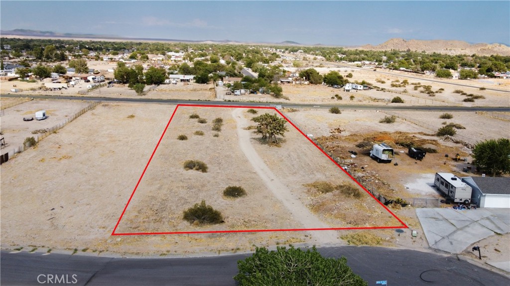 Great opportunity to own a vacant residential lot in the growing community of Lake Los Angeles! This spacious lot is ideally located between existing homes, with a water meter already installed and utilities nearby, making it easier to start building your dream home or investment property. Enjoy peaceful desert living with the convenience of nearby schools, parks, and shops. Don't miss this ready-to-develop parcel in an established neighborhood!