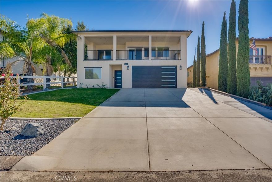 Nestled in the desirable Woodcrest neighborhood, this stunning two-story residence offers spectacular hillside and city views, providing a breathtaking backdrop to everyday life. NO HOA, NO MELLO ROOS, and Low Taxes

With just under 3,000 square feet of living space, this beautifully designed home features 4 spacious bedrooms, 3 full bathrooms, and a dedicated office area. The first floor showcases elegant plank tile flooring, while the second floor features durable luxury vinyl plank flooring. All bathrooms are finished with timeless porcelain tile.

The gourmet kitchen is a culinary dream, featuring premium quartz countertops and a seamless flow into the open-concept family room—perfect for entertaining or relaxed everyday living.

Step outside to enjoy the covered patio and professionally landscaped front and back yards, designed for both beauty and low maintenance. The private upstairs balcony offers sweeping views, ideal for enjoying your morning coffee or unwinding at sunset.

This energy-efficient home includes fully paid-off solar panels, dual A/C units for zoned climate control, and a 50-amp EV charger—ready for your electric vehicle. Fire sprinklers throughout add an extra layer of safety and may help reduce insurance costs.

Additional highlights include an oversized laundry room with generous pantry space and an attached two-car garage.

Don’t miss your opportunity to own this thoughtfully upgraded, move-in-ready home that blends custom craftsmanship with modern comfort.