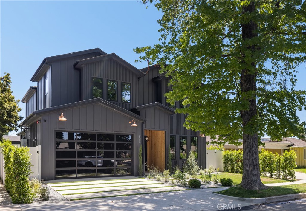 Spectacular Modern Farmhouse situated in the prestigious Sherman Oaks pocket, a neighborhood known for its charm and community spirit. This stunning five-bedroom, 5 1/2-bathroom masterpiece spans approximately 3,500 square feet of luxurious living space on a generous lot. Designed and meticulously crafted with a keen eye for the finest designer finishes, it offers breathtaking aesthetics and comfort, creating a unique, welcoming atmosphere.As you step inside, you're greeted by an open, free-flowing layout bathed in natural light, enhancing the home's stunning features and innovative design. This home is outfitted with state-of-the-art smart home technology, putting control and convenience at the touch of a button.At the heart of the home lies a custom chef's kitchen, equipped with top of the line appliances, and ample space for preparing gourmet meals. From quick breakfasts to elegant dinner parties, this kitchen serves every occasion with ease.The main bedroom, a sanctuary of calm and opulence, is paired with an ensuite bath for a resort-like experience, surrounded by natural wood and privy to the home's brilliant design.Outside, the property continues to impress. A sprawling, private backyard creates a resort-like ambiance, complete with a sparkling pool, spa, and beautifully designed barbecue area. The grounds are delicately landscaped with mature Ficus trees and an elegant cabana, perfect for entertaining on warm summer nights or simply unwinding after a long day.Don't miss the opportunity to own this unique Modern Farmhouse, a symbol of timeless elegance and sophistication. Experience the perfect blend of lifestyle and luxury at 5222 Ventura Canyon Avenue.