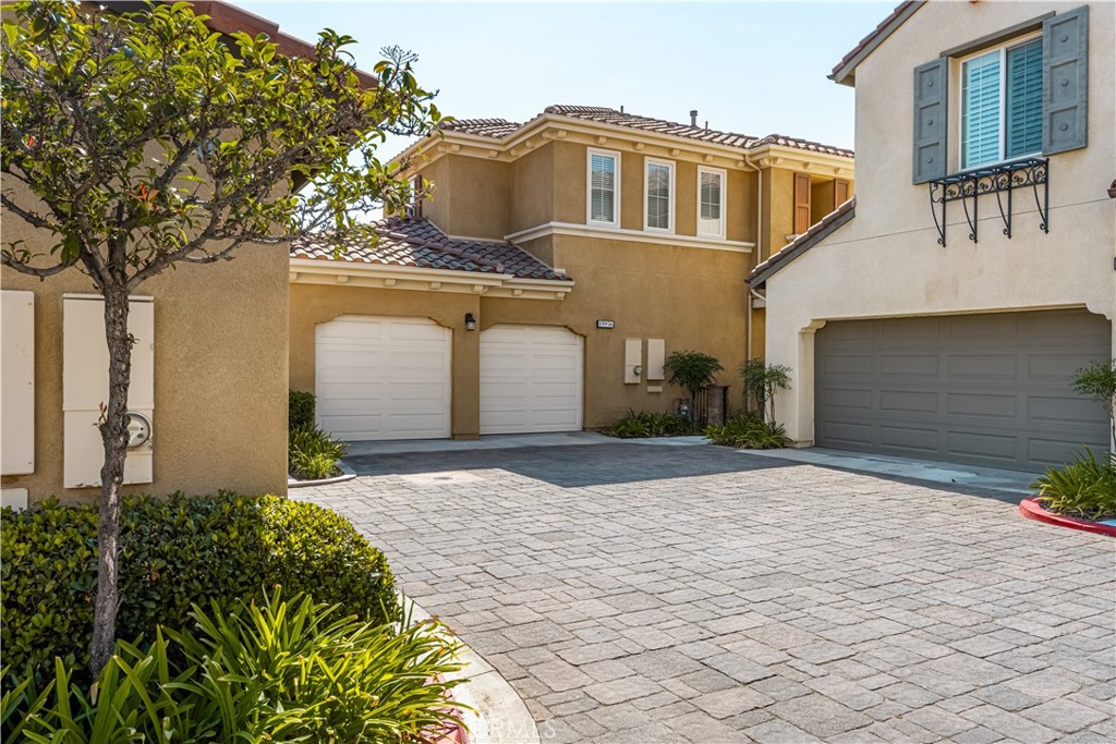 Welcome to this beautifully upgraded end-unit condominium in the desirable Tierra at Villagio community. This detached home features an open floor plan with a gourmet kitchen, including a 42” built-in refrigerator, stainless steel appliances, a large island, granite counters, white custom cabinetry, and a 5-burner gas stove. The kitchen flows seamlessly into the dining and family rooms, bathed in natural light. The main floor offers tile throughout, a powder room, and a laundry room with extra storage. Upstairs, you'll find generously sized bedrooms, two of which share a Jack-and-Jill bathroom with dual vanities. The spacious primary bedroom includes custom shutters, a walk-in closet, and a luxurious en-suite with separate vanities, a soaking tub, and a walk-in shower. The oversized lot is ideal for entertaining and features low-maintenance hardscaping and beautiful landscaping. The 2-car garage is equipped with a tankless water heater, ensuring endless hot water.