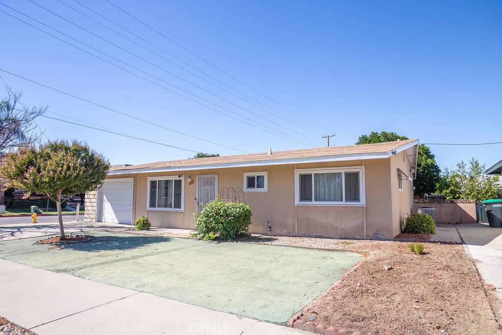 This charming 2-bedroom, 2-bathroom home offers 1,008 sq ft of thoughtfully updated living space in a peaceful 55+ community. this single-level corner home features a low-maintenance yard with hardscape, mature hedges, and a citrus tree in the backyard. Inside, you’ll find laminate flooring in the main living areas, updated bathrooms, and an upgraded kitchen with quartz countertops, tile backsplash, and stainless steel appliances. The inviting living and dining spaces are accented with wainscoting, while the enclosed sunroom provides a flexible space for an office, hobby room, or relaxation area. The backyard is block-fenced, with shade provided by the citrus tree. The laundry room features additional cabinet storage and is conveniently connected to the garage for easy access.Sun Park II Senior Community offers unique resident only direct access to the private park and HOA clubhouse with pool,The backyard has an access gate to the community pool and horse shoe pits, etc. Located in the 55+ Sun Park II community and is conveniently located to parks, restaurants, shopping center, bus stop nearby, and more!
