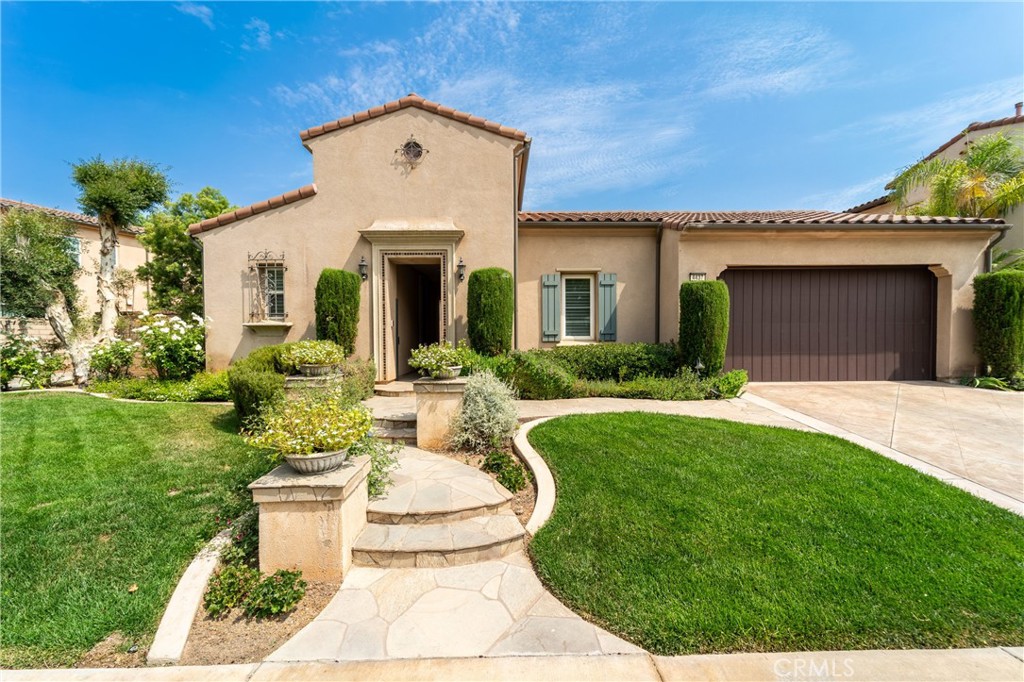 Welcome to effortless luxury in one of Corona's most exclusive gated communities- Temescal Heights bordering the prestigious Dos Lagos Golf Course. This single-story residence offers panoramic views of rolling greens, multiple fairways and the iconic Cleveland National Forest, setting the scene for truly elevated living. The entertainer's layout flows beautifully from the chef's kitchen, complete with custom granite counters and stainless-steel appliances, into the backyard, where evenings come alive- the ambience here? Unmatched! The home wraps around an inviting courtyard complete with fireplace and built in pizza oven. Adjacent to the courtyard is a separate home office/gym/casita? or personal escape. Inside, the home offers 3 bedrooms 3 bathrooms and 2,547 square feet of open, thoughtfully designed space. The primary suite delivers peace and privacy, featuring a large panoramic window, a relaxing spa-like bath, double sink vanity and a large walk-in closet. There are gorgeous floors throughout the house, a separate dining room for formal events and then there's living/family room with cozy fireplace and mountain views ensuring that whether you're hosting, relaxing or simply enjoying the views This home delivers on every level. The entire property is architecturally designed using custom hardscape and beautiful landscape. Additionally, the house has surround-sound system and a soft water system that protects your plumbing and water fixtures. From your house you could easily walk to Dos Lagos and enjoy dinner at Wood Ranch, catch a movie or even shop at Trader Joe's or grab your clubs and play a round of golf.