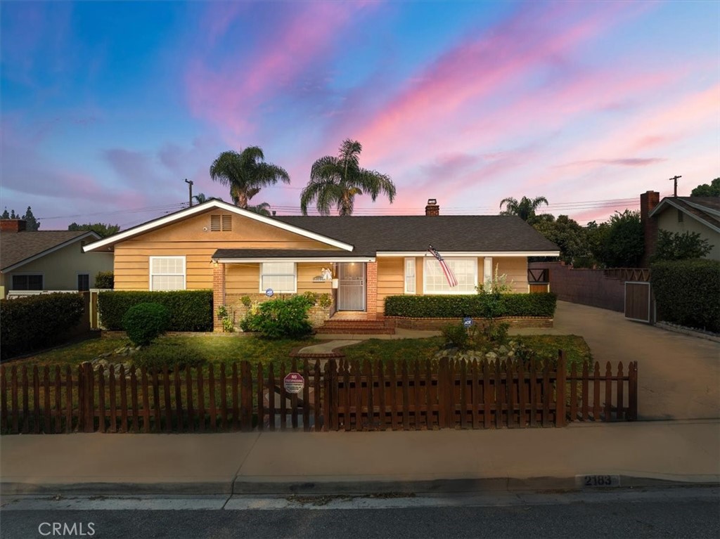 Welcome to 2183 Sinclair St, a delightful single-family residence. A beautifully maintained 3-bedroom, 2-bathroom single-family home located in the heart of Pomona. With 1,578 square feet of thoughtfully designed living space, this 1957-built gem sits on a generous 8,946-square-foot lot, offering ample room for both indoor and outdoor living. This property comes with a 360-degree camera security system and a bolted safe that will remain with the home, providing peace of mind for new owners. The home has been recently updated with a newer roof and HVAC system. Dual-pane windows throughout provide excellent insulation and noise reduction. Outside in the front, the property is fully fenced with a city-approved picket fence, and a automatic main gate that leads to the backyard offering curb appeal and security. There is plenty of room for RV parking and a detached garage, which has the potential to be converted into an Accessory Dwelling Unit (ADU) for extra living space or rental income. The home also includes a Chime Network that works with all the Ring cameras, giving you an alert anytime there’s motion around the property. Don't miss the opportunity to make this lovely house your new home!