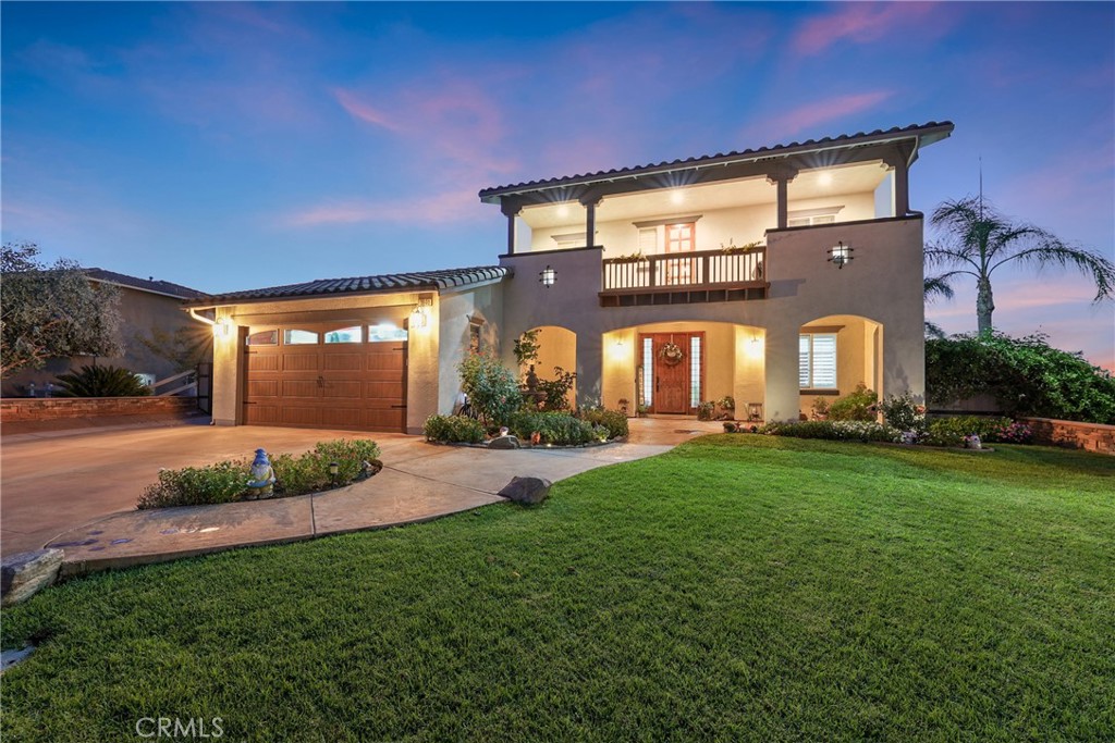 Stunning Norco Hills home! This spacious 6-bedroom, 4-bath residence offers over 3,400 sq. ft. of elegant living space with deluxe diamond-set tile, wood flooring, and shutters. The gourmet kitchen features granite counters, island with breakfast bar, and walk-in pantry. Upstairs includes a hallway desk, view deck, convenient laundry room, and multiple bedrooms, including a junior suite with private bath. The luxurious primary suite boasts breathtaking views, recessed lighting, and a spa-like bath with dual vanities, jetted tub, walk-in shower, and expansive walk-in closet. Set on nearly ½ acre, the entertainer’s backyard boasts STUNNING infinity-edge views, fresh sod, expansive patios with alumawood covers, fire pit, dual BBQ island, and lush palms. Enjoy RV parking up to 138 ft with custom gates, 3-car garage, paid-off solar panels, and an EV charger. Nestled on a quiet cul-de-sac, this home blends energy efficiency, style, and unbeatable views!