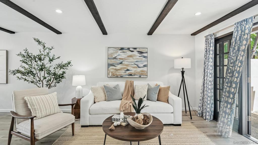 Experience unparalleled luxury in this exquisitely remodeled contemporary townhome in La Jolla. This elegant 2-bedroom, plus bonus room, 2.5-bath home features an open-concept design that seamlessly transitions to multiple patios, perfect for refined outdoor entertaining. Step inside to find Mediterranean-inspired architecture with wide-plank luxury floors, exposed beam ceilings, and a cozy brick fireplace. The gourmet kitchen is a chef's dream, equipped with top-tier appliances and range, a wine fridge, custom cabinetry, plus quartz countertops. The capacious primary suite boasts soaring vaulted ceilings, a private balcony, and an opulent en-suite bathroom with dual sinks and a custom shower. The second level also includes a spacious second bedroom, a fully upgraded second bathroom, plus a versatile bonus room perfect for a home office or nursery. The 2-car garage features an epoxy floor, Electrolux washer and dryer, water heater, plus extensive built-in storage for your convenience. Located in the coveted Villas Mallorca, enjoy amenities including tennis courts, a heated pool and spa, and lush landscaping. Positioned moments from UTC shopping and dining, major freeways, the enchanting La Jolla Cove and beaches, and UCSD. Zoned for top-rated La Jolla schools, this tranquil haven offers the best in luxury living.