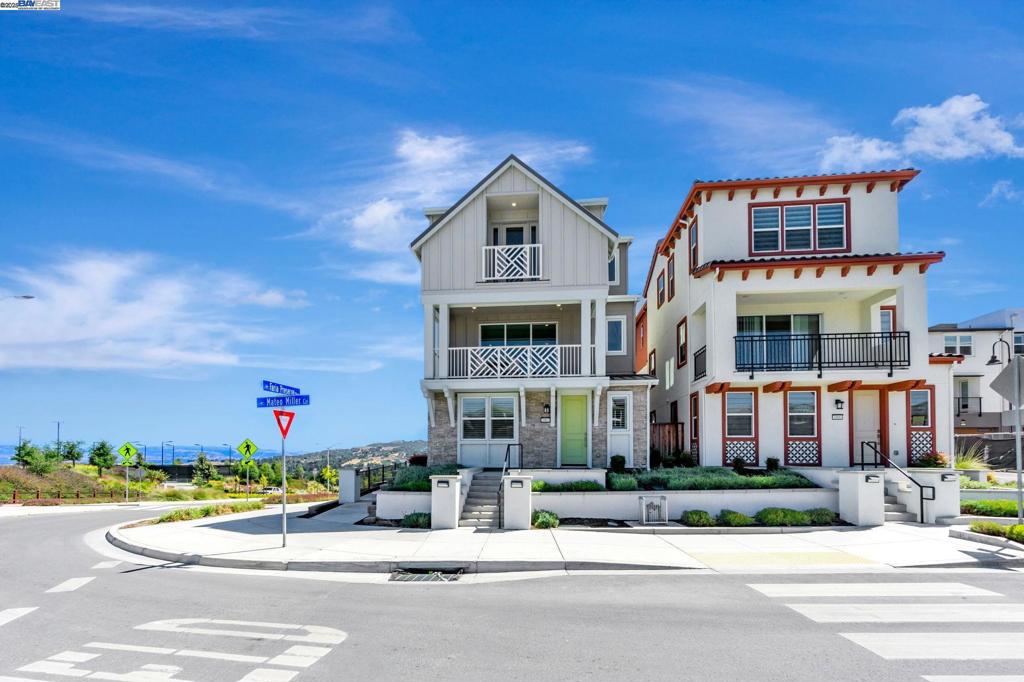 Luxury residence in the exclusive and completely sold-out Twin Oaks Arbor enclave – an intimate community of just 40 “detached condo” homes built by premier homebuilder Toll Brothers. This North-facing corner home is located across from picturesque Sunrise Ridge Park, and enjoys expansive hill views in a serene setting. Flexible floorplan includes a first-floor bedroom suite & separate flex space – perfect for multi-generational living & a home office or gym. Expansive open concept Great Room seamlessly integrates the kitchen, dining & living areas and leads to a large covered balcony with stacking doors that open all the way up for indoor/outdoor living. The gourmet kitchen showcases an oversized center island, beautiful custom cabinetry, quartz countertops, 42” built-in LG fridge, JennAir appliances, walk-in pantry & separate prep nook. 9-feet tall ceilings and gorgeous engineered oak hardwood floors complete this level. Relax in the Primary Suite with spa-like bath & soaking tub, spacious walk-in closet, and Juliet balcony. Additional features include over $90K in upgrades, owned Solar, EV charger outlet, electric water heater w/ recirculating hot water system, 3-zone AC, custom window treatments and more. Luxury, Serenity, and Location – don’t miss this exceptional home!
