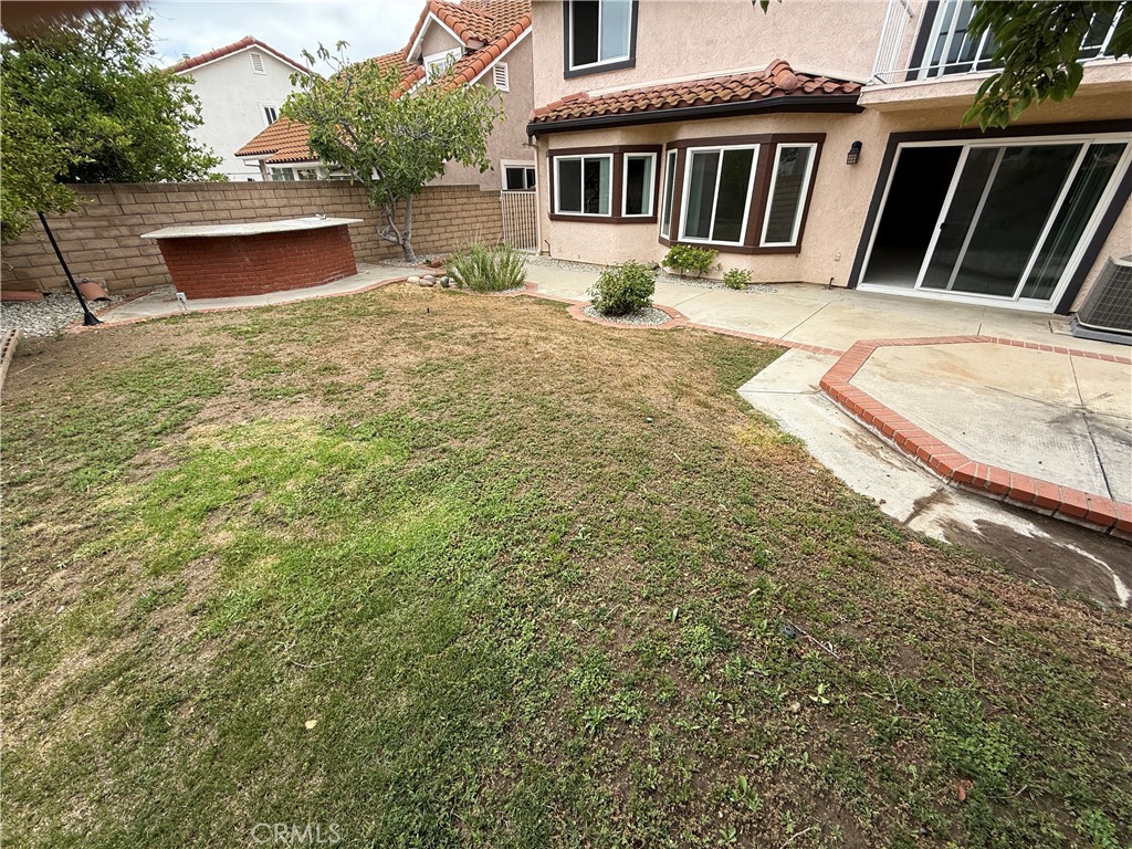 Remodeled single family home located in the 24 hour guard gated community known as 'The Estates at Porter Ranch'. Front gated courtyard opens to a light and bright floor plan with living/dining room and separate family room, new paint and upgraded carpet. Newer kitchen cabinets, granite countertops and stainless steel appliances with patio views. All bedrooms upstairs. Enjoy the balcony off the master suite. Upgraded baths and more. Don't forget the good sized backyard with, grass, patio, fruit trees and outdoor eating area. Community pools, spa, tennis courts, playground basketball, and more. Nearby large community park, YMCA, Porter Valley Country Club and the almost new "Vineyards shopping mall" with Whole Foods, movie theater and many restaurants.