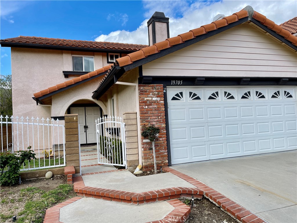 Remodeled single family home located in the 24 hour guard gated community known as 'The Estates at Porter Ranch'. Front gated courtyard opens to a light and bright floor plan with living/dining room and separate family room, new paint and upgraded carpet. Newer kitchen cabinets, granite countertops and stainless steel appliances with patio views. All bedrooms upstairs. Enjoy the balcony off the master suite. Upgraded baths and more. Don't forget the good sized backyard with, grass, patio, fruit trees and outdoor eating area. Community pools, spa, tennis courts, playground basketball, and more. Nearby large community park, YMCA, Porter Valley Country Club and the almost new "Vineyards shopping mall" with Whole Foods, movie theater and many restaurants.