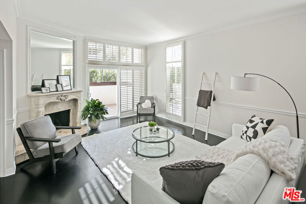 This 2 bedroom, 2.5 bath end unit in the Palisades Highlands offers an open floor plan, high ceilings, and ample natural light. Enter into the main living areas with charming plantation shutters, patio, fireplace, and step-up dining room. The kitchen boasts elegant beadboard cabinetry, granite counters, farmhouse sink, and stainless steel appliances, and opens to a cozy family room with built in shelving. Upstairs, the primary suite has soaring ceilings, office nook, large walk-in closet, and en-suite bathroom. The secondary bedroom has built-in shelving and en-suite bath with spa tub. The unit includes side-by-side washer & dryer, and direct access two-car garage. The tranquil community includes a tennis court, gym, pool, and spa.