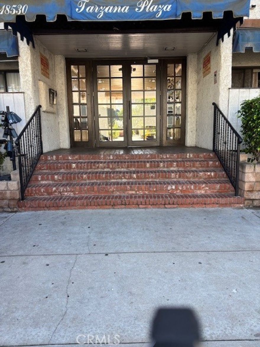 Welcome to this gorgeous remodeled top floor Penthouse level condominium home in the heart of Tarzana.  Upgraded throughout with the finest detailing makes this one so special in an incredible location. The open kitchen now features dual stainless steel sinks, Samsung stainless appliances including gas four burner range/oven, microwave, dishwasher, and a brand new LG stainless refrigerator/freezer.  Wait until you see the impeccable quartz counters with designer tile splash back and designer cabinetry.  There are brand new wide plank laminate flooring throughout this spacious unit.  The dining area has a ceiling fan lighting which looks out to the spacious balcony that overlooks the openness of quiet space with partial views out to hills.  This one is extremely light and bright with the southwest views. Location is in the rear of the building for added quietness.  The unit has just been painted. Both of the bedrooms now feature recessed lighting.  Each bedroom is nicely sized with excellent closet space and full baths with designer shower fixtures.  The one bedroom also features a vanity area. This home feels so much larger than the actual square footage.  The HOA is only $400/month and includes water, pool and spa area, community BBQs, community laundry on each level (only steps away from the unit on the top level), recreation room, trash, sewer, and pets are allowed.  Gated community for added security. Check the comps and other units for sale in this complex and this remodeled top floor two bedroom unit is a great value.  Vacant, go direct, and ready to go!