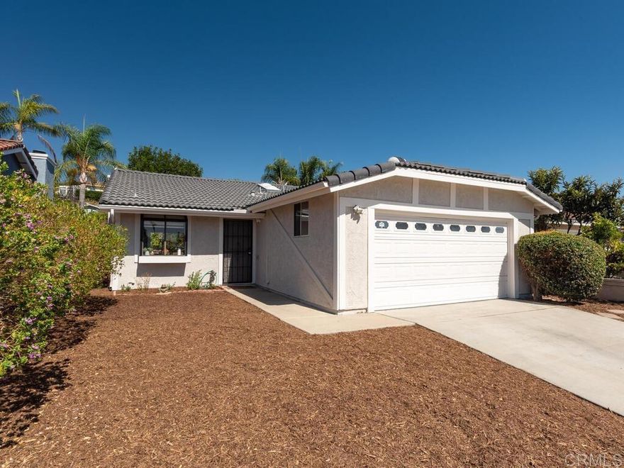 Great family home with additional 3rd room.  Family currently uses it as a bedroom without the closet.  Roof was replaced last year. Piping in home has been replaced and new water heater.  Fresh paint inside and out. This lot is flat and ready for an ADU in the rear or your own trees and garden.  Grape vine has been cut back but still has grapes. Conveniently located near freeway access and an abudance of shopping nearby.