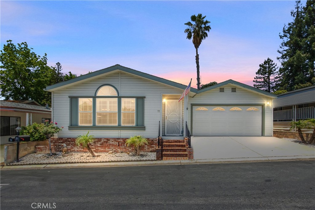 WELCOME to this beautiful home located in Valencia Lea 55+ park. It is one of the most prestigious areas it is nestled at the base of the gorgeous San Bernardino mountains close to shopping centers, freeways and restaurants. This charming home has 1440 sq ft with 2 large bedrooms, features a spacious kitchen with newer appliances and a large living room. The primary room offers 2 large walk-in closets, spacious primary bathroom double sinks with a walk-in shower and with a linen cabinet. For your convenience there is an indoor laundry room it offers counter space for folding , sink and storage cabinets and washer and dryer are included also there's sun roof, 2 car attached garage with built in cabinets for extra storage. Security door on the front door. Has a newer roof, fans are in the bedrooms and living room. Large covered patio to enjoy and relax.The park features pool, 2 spas,2 club houses, 2 bbq areas along with the green belt, koi pond and activities. This home has been well maintain YOU MUST SEE.