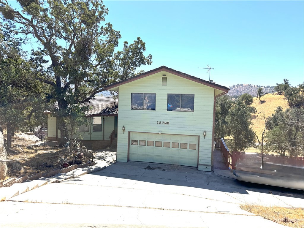 Three stories of livable space with two parcels included and wide-open mountain views—a rare blend of scale, flexibility, and location in Tehachapi. The ~3,938 sq ft (˜366 m²) plan delivers 4 bedrooms / 4 baths (2 full, 1 three-quarter, 1 half) across three levels, including a finished lower level that functions like a second living floor for media, fitness, studio, play, or overnight guests. Classic 1987 wood-frame construction is paired with a tile roof, central A/C, and forced-air propane/butane heat for year-round comfort.
Day-to-day life centers on a generous kitchen with ample prep and storage and easy flow to dining and living areas—practical for cooking together, hosting, or a quiet coffee with the mountain backdrop. Upstairs, well-separated bedrooms offer privacy; downstairs, the finished floor keeps the main level uncluttered and ready for gatherings. An attached 2-car garage adds everyday convenience, and the property’s lines invite outdoor dining, gardening, and projects.
Included in the sale are two adjacent parcels (APNs 317-510-19 & 317-510-18; buyer to verify sizes, utilities, and intended use). Keep the second parcel for privacy, explore garden/workshop concepts, or investigate local pathways for ADU or additional structures—all subject to city/county approvals and your own due diligence. The main lot is approximately ~0.80 acre (˜0.32 ha) with orientation that frames the mountains from multiple vantage points.
Area context that pays off long-term: Tehachapi offers a true four-season mountain climate, blue-sky days, and a calm, outdoorsy feel—while the State Route 58 corridor connects quickly to SR-14/US-395/SR-99/I-5 for regional reach. That means easy trips to major employment centers, logistics routes, Mojave aerospace/renewables activity, and high-desert recreation—often at price points that compare favorably with coastal markets.
Quick facts (at a glance):
Interior: ~3,938 sq ft (˜366 m²)
Beds/Baths: 4 / 4 (2F / 1¾ / 1½)
Stories: Three with a finished basement (true second living/flex level)
Lot: ~0.80 acre (˜0.32 ha) + additional parcel included
Systems: Central A/C; forced-air propane/butane heat; no interior fireplaces
Build: Wood-frame, wood exterior, tile roof
Parking: Attached 2-car garage
Views: Mountain | Year built: 1987
APNs included: 317-510-19 and 317-510-18
Buyer to verify all information