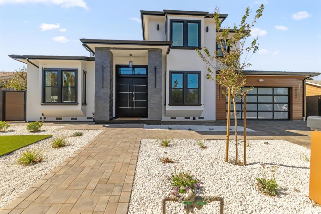 Spanning approximately 6,000 sq. ft., this luxury property includes a meticulously crafted main residence (3,770 sq. ft.), an ADU (720 sq. ft.), and well-appointed outdoor spaces: a front porch (50 sq. ft.), rear patio (600 sq. ft.), and balcony (411 sq. ft.).The main level welcomes you with a grand foyer featuring 15-foot ceilings and a dramatic 21-foot circular staircase. This level also includes a guest master suite, powder room, spacious office, and an inviting guest suite with a fireplace. The gourmet kitchen, complete with high-end Thermador appliances and a stunning waterfall island, opens to a spacious living area with glass bi-fold doors leading to a covered patio, creating an effortless indoor-outdoor flow.Upstairs, a luxurious primary suite and two additional master bedrooms each provide a private retreat, featuring full tile finishes, wall-mounted toilets, and custom cabinetry. The attached ADU offers two additional master bedrooms, adding flexibility for guests, rental income, or a business setup. Enhanced with a premium security system and solar installation, this home combines luxury with efficiency.The builder offers a comprehensive warranty under California SB 800, ensuring peace of mind. Fully inspected and move-in ready.