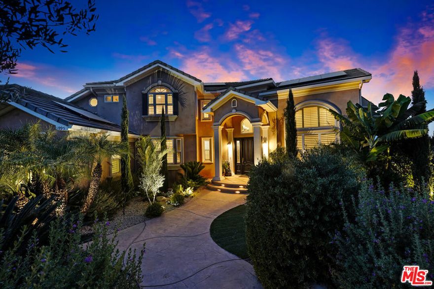 REDUCED! Stunning Mediterranean Hidden Gem! This exquisite custom home with views of Conejo Valley is set on a spacious 29,273 SqFt lot and showcases soaring ceilings and cathedral windows, providing an abundance of natural light through classic shutters. The gourmet chef's kitchen features a center island, granite countertops, stainless steel appliances, and a walk-in pantry, flowing seamlessly into the spacious family room. The luxurious primary suite offers a veranda with views, a bedroom fireplace, his-and-hers walk-in closets, separate his-and-hers toilet rooms, a soaking bathtub, and a glass-enclosed shower. On the lower level, a 530 SqFt mother-in-law studio with a private entrance includes an en-suite bathroom, kitchenette, and stackable washer/dryer. A bonus room above the garage offers large additional storage, accessible from the second floor. Enjoy the convenience of two 2-car attached garages and extra space for more vehicles in the driveway. Additional upgrades include a newer solar system, tankless water heater, dual-zoned AC, and a utility room. Step into a backyard paradisean entertainer's dreamfeaturing a newer saltwater pool and spa, luxurious outdoor living areas with multiple patios, and a spacious gazebo with a built-in barbecue, pizza oven, fireplace, and television. The meticulously landscaped grounds incorporate drought-tolerant plants, turf, and fruit trees. This is a rare offering of unique and exceptional estate!