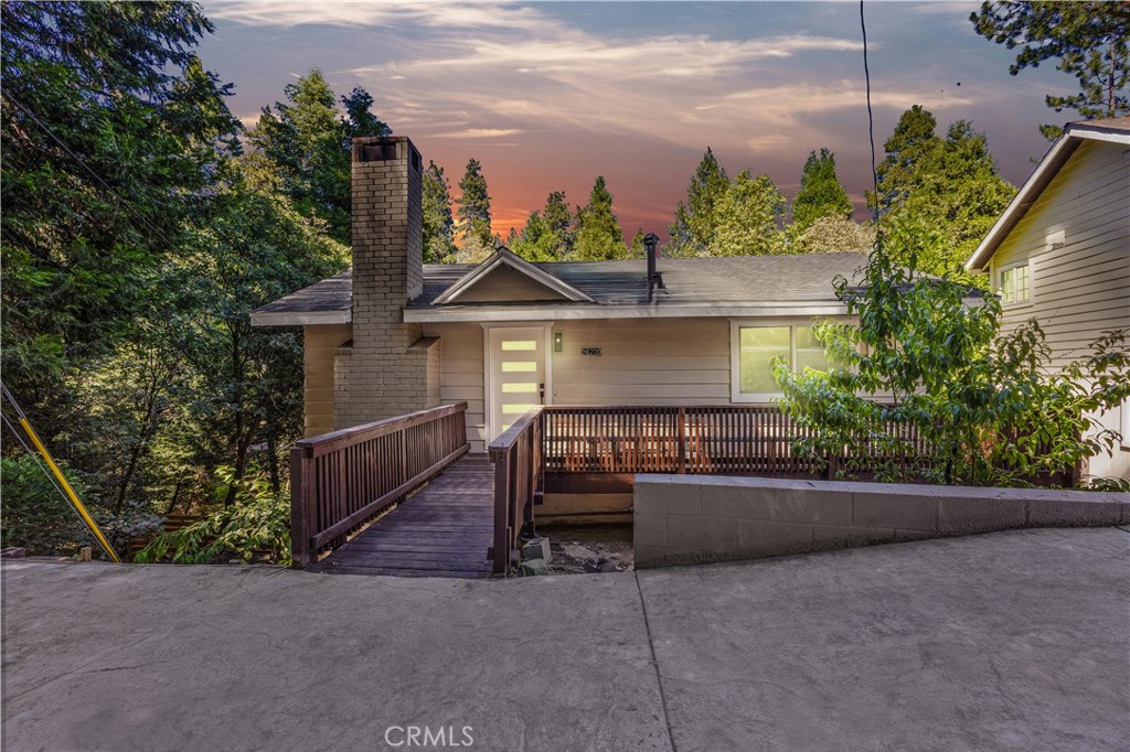 A MUST SEE to experience home. Nestled in the tranquil mountain community of Twin Peaks, 26770 State Highway 189 offers a perfect blend of modern comfort and natural charm. This beautifully updated home features a stylish interior with high ceilings, all-new appliances, a large quartz kitchen island with custom European style cabinets, and a cozy wood-burning fireplace. The versatile layout includes a bonus room and a very generous walk-in closet in the primary bedroom. Step outside to enjoy three expansive decks, perfect for entertaining or simply taking in the serene surroundings. Set on a large, fenced lot with no neighbors to the left, just trees, birds, and the occasional bear. ALWAYS SURROUNDED BY WILDLIFE. This property offers unmatched privacy and peacefulness. A private driveway provides ample parking, and you’re just a short drive from both Lake Gregory and Lake Arrowhead. This is truly a must-walk property to fully appreciate the space, setting, and character it offers. Whether you’re looking for a full-time residence or a mountain getaway, this home delivers the best of both worlds. Schedule your private showing today! Some photos have been electronically staged.