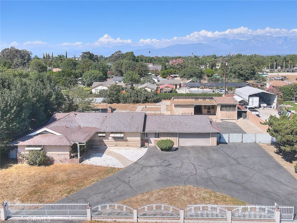 INCREDIBLE POTENTIAL!!! Boasting an expansive lot of 43,255 sq ft (per tax roll) this property has endless options for improvement and development. The lot is zoned for both residential and agricultural uses. Situated on a quiet cul-de-sac with tastefully maintained properties this SINGLE story ranch style home features 3 bedrooms and 2 bathrooms. Notables: Horse property with corrals, saddle rooms, a work shed, center yard canopy and an extra large high-ceiling barn. Ample space for ADU or other structures. Currently zoned for up to 8 residential units. (buyer to verify) This lot is perfect for RV parking or for other home businesses that need large amounts of space for parking equipment or other desired use. Mature fruit producing trees on the property including white peaches and other more unique types of fruits. Trivia for nostalgia and movie lovers: The barn was originally built as part of a movie set for the 1947 western "The Texas Uprising" which was originally released under the title of "The Fabulous Texan" in 1947 and starred William "Wild Bill" Elliot. The barn includes multiple padlocked storage rooms, a workshop room, another open workshop in the back of the barn and an easy access large front storage area with built-in shelves which can accommodate interior parking for an RV or boat. The front has gated semi circle drive and there are 2 separate entrances to the property, one on Larkwood and one on McKinley. There is a 2 car garage that is attached to the home by an enclosed breezeway, conducive to a home office space. A truly unique property waiting to be transformed!