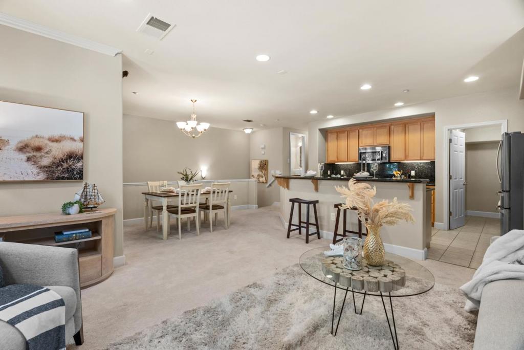 Beautiful 2 bed, 2.5 bath townhouse-style condo in the desirable Villas at Lundy by Toll Brothers. Bright and open floor plan with spacious living room, modern kitchen with granite countertops and stainless steel appliances, and a covered private balconyperfect for entertaining. Primary suite features a spa-like bath with dual vanities, soaking tub, separate shower, and large walk-in closet. In-unit laundry and attached side-by-side 2-car garage. Resort-style community with pool, spa, clubhouse, and landscaped grounds. Excellent North San Jose location near BART, VTA, Townsend Park, top private schools (Challenger & Stratford), shopping, dining, and major tech campuses. Easy commuter access via nearby freeways.