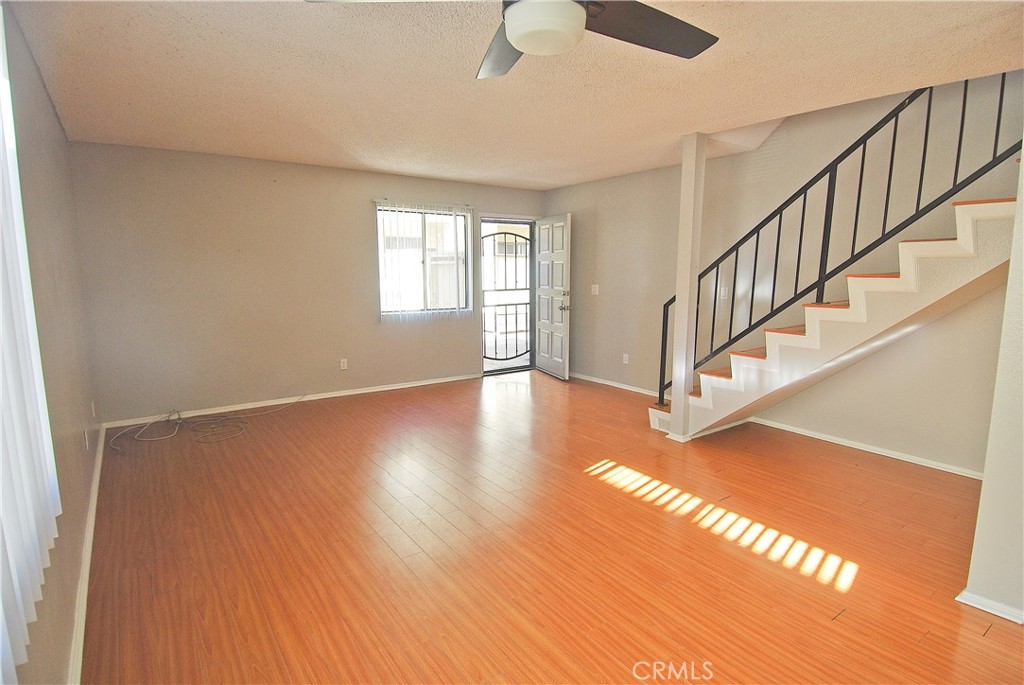 Welcome to this lovely, sunny and bright, two story end unit in a secured community in East Torrance. Freshly painted throughout the unit, the entry level offers a spacious living room with laminate flooring, a kitchen (equipped with brand new refrigerator and oven/stove) that opens onto the living room, a half bathroom, storage area (under the staircase leading upstairs), and washer/dryer hookups. The upstairs offers two bedrooms and a full bathroom. The unit is located toward the rear of the complex off the street, thus is quiet and tranquil. There are two reserved parking spaces in the subterranean garage. How rare to find such a well-kept, sunny end unit, with laundry hookups in the unit and two subterranean parking areas. And it is waiting just for you.