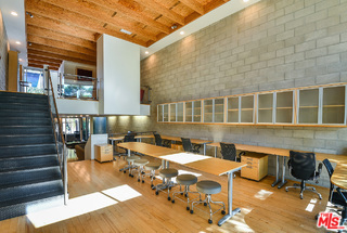 INCREDIBLE TRI-LEVEL LIVE WORK LOFT ON MELROSE. This expansive, south facing creative loft (approximately 3,000 square feet with garage space included) features an open floor plan with soaring ceilings and hardwood floors, including a full kitchen with granite counters and stainless steel appliances, three bathrooms, and a large, private sun deck with a retractable awning. There is an automatic, direct-access garage with room for six tandem cars or for use as additional work space. Additional features include dual-zone HVAC, recessed lighting, security camera, and walls of dual pane windows. Easily fitting 25 plus work stations, the property is perfect for use as a creative office space, tech company, production company, entertainment or multimedia company, design or photography studio, or as a beautiful and unique home. Ideally located in the "Beverly Hills of Hollywood" near studios/entertainment companies and some of L.A.'s best shops and restaurants, this one is a rare find.