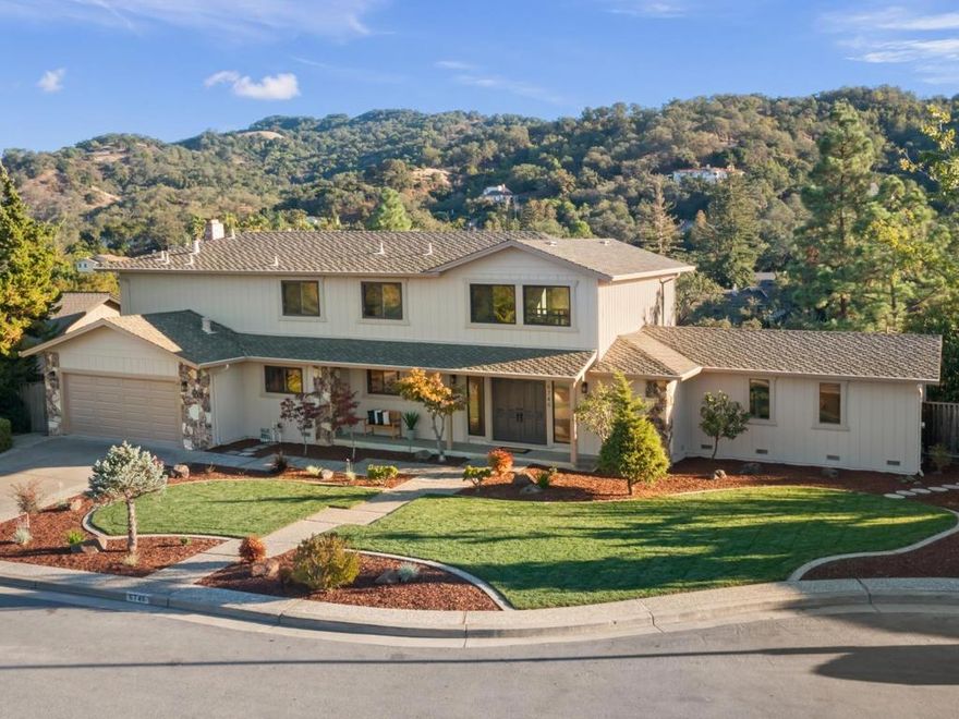 Perched at the top of one of Almaden Country Club's most coveted streets, this executive home on Lookout Bend captures breathtaking views of the Almaden hills and Quicksilver Park from nearly every window. Its prime location at the end of a long cul-de-sac provides exceptional privacy and a peaceful, natural setting. Step inside to the awe-inspiring living room filled with natural light provided by 18-foot ceilings and expansive windows. Elegant dining room opens to a private deck, perfect for entertaining or relaxing outdoors. Updated kitchen showcases granite counters, hardwood floors, and stainless-steel appliances, while the spacious family room features four large windows and a cozy wood-burning fireplace. Spacious primary suite conveniently located on the main level. Upstairs you will find three additional bedrooms plus a loft with views reaching all the way to downtown San Jose. Fresh interior paint, newer LED recessed lighting, newer carpet, newer dual-pane windows, and freshly manicured landscaping complete this stunning home. All this and access to top Almaden's highly-regarded schools including Leland High. Don't miss this rare opportunity. You'll love it
